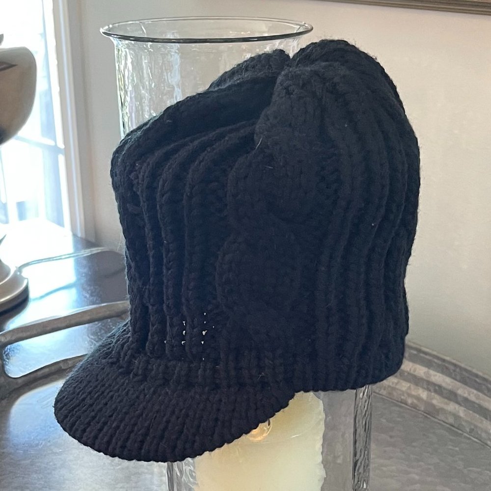 Jockey-style knit winter hat with solid brim